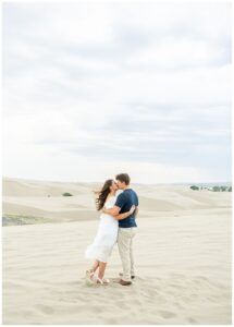 romantic engagement session at the st Anthony sand dunes