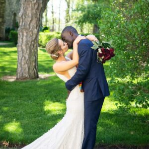 wedding photography of bride and groom kissing